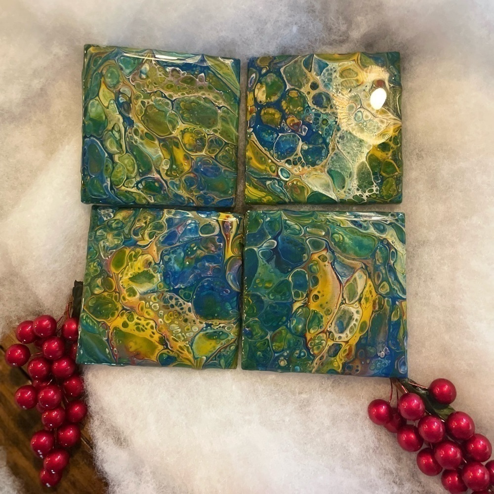 Set of 4 hand painted coasters. Sealed with resin cork backing Blues & greens